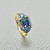 1.50 carat bi color tourmaline ring with aquamarine and tanzanite accents