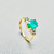 Yellow gold ring featuring large oval emerald centerpiece Yellow gold ring featuring large oval emerald centerpiece