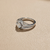 Round-cut diamond engagement ring in split-shank setting — gallery view