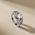 Round-cut diamond engagement ring in split-shank setting — side profile