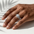 Round-cut diamond engagement ring in split-shank setting — flat lay view