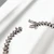 Catch clasp detail on white gold diamond tennis bracelet