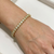 Natural diamond tennis bracelet 10kt yellow gold close-up