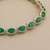 Emerald and diamond halo tennis bracelet 10.40tcw 14kt yellow gold front view