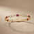 Oval ruby tennis bracelet 14kt yellow gold detail