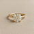 1.56tcw round-cut diamond engagement ring in solitaire setting in yellow gold — three-quarter angle