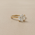 1.56tcw round-cut diamond engagement ring in solitaire setting in yellow gold — close-up detail