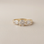 0.87tcw round-cut diamond engagement ring in three-stone setting — close-up detail (2)