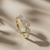 0.87tcw round-cut diamond engagement ring in three-stone setting — on-hand modeled view
