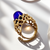 Detail of yellow gold band on statement ring