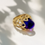 Bold profile view cabochon amethyst statement ring