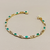 Entry tier emerald tennis bracelet 14kt yellow gold side profile