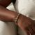 Natural oval emerald and diamond bracelet 14kt yellow gold close-up