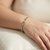 Slim emerald and diamond bracelet 14kt yellow gold detail
