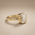 Emerald-cut diamond engagement ring in solitaire setting — top view