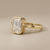 Emerald-cut diamond engagement ring in solitaire setting — three-quarter angle