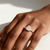 1.50ct radiant-cut diamond engagement ring in three-stone setting — front view