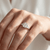 Emerald-cut diamond engagement ring — three-quarter angle