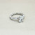 Round-cut diamond engagement ring — close-up detail