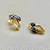 Unique sapphire and diamond earrings with 1.55tcw gemstones, featuring oval-cut sapphires and tapered baguette diamonds in an elegant design Treasured & Co.