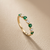 Half eternity emerald and diamond wedding band 14kt yellow gold front view