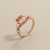 Lab-created padparadscha sapphire ring top view 2.50 carat cushion cut