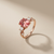 Cushion cut padparadscha sapphire ring 14kt rose gold angle view