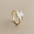 Radiant cut diamond ring with baguette accents low angle view yellow gold