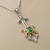 Tsavorite green garnet sword pendant 14kt gold 925 silver low angle view