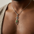 Tsavorite sword pendant necklace full model view 22 inch cable chain