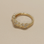 X crisscross gold ring with diamonds top side