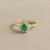 Pear emerald and diamond ring 14kt yellow gold lifestyle shot