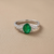 1.45tcw oval-cut emerald engagement ring — three-quarter angle (2)