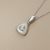 0.30tcw cubic zirconia accents in 14kt white gold triangle pendant detail