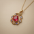 Synthetic ruby pear-cut pendant 14kt yellow gold close-up of stone