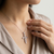 Petite diamond cross necklace 10kt white gold lifestyle shot