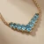 Oval Blue Topaz & Diamond Chevron Necklace