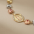 Virgin Mary gold bracelet with butterfly charms tri-color 14kt yellow gold front