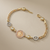 Virgin Mary leaf-link cross bracelet 14kt yellow gold lifestyle shot