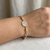 Mary medal cross charms 14kt yellow gold bracelet profile detail