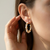Gold and pearl hoops 14kt yellow gold lifestyle shot