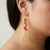 Red coral and gold drop earrings 14kt yellow gold lifestyle shot