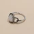 Black diamond cluster ring side profile showing 14K white gold band and low-set cluster