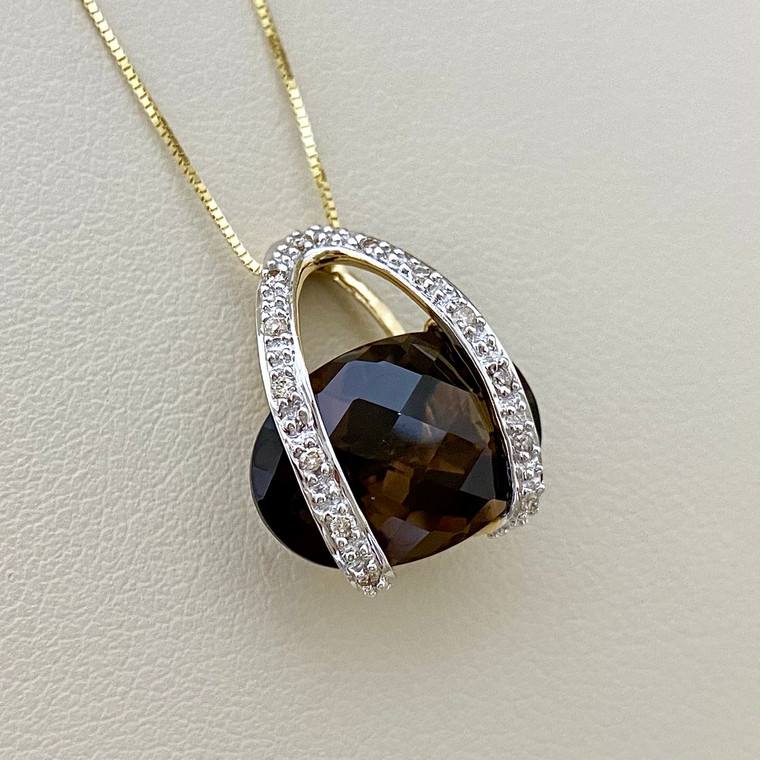 Smokey topaz pendant necklace featuring a 5.60tcw gemstone accented with diamonds, set in elegant 14kt yellow gold Treasured & Co.