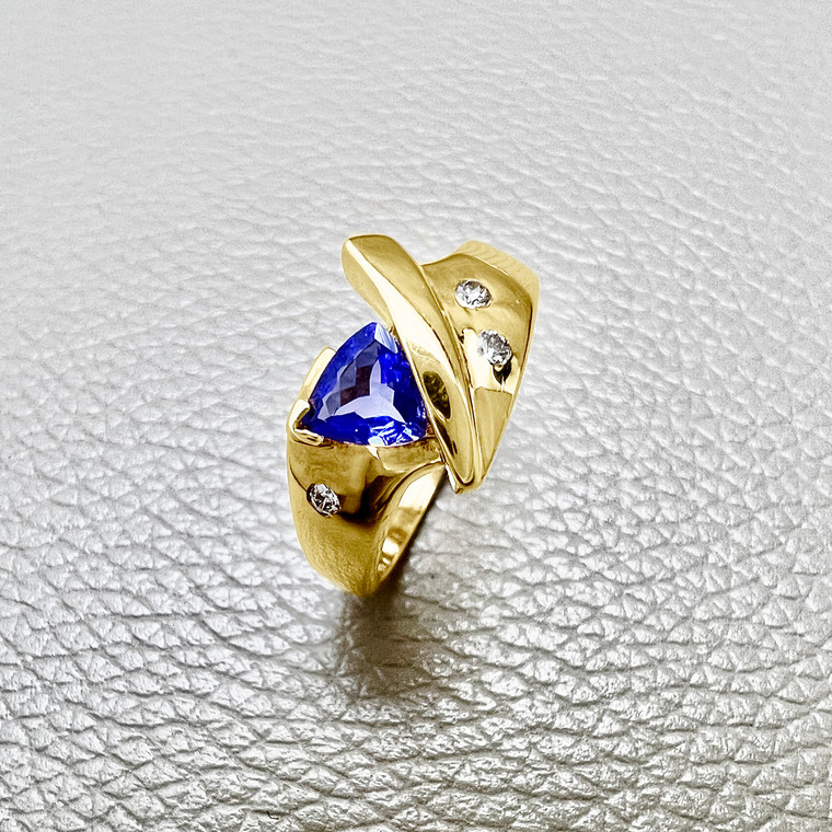 Trillion tanzanite ring featuring 0.41tcw, crafted in 14kt yellow gold, a unique design perfect for both men and women Treasured And Co.