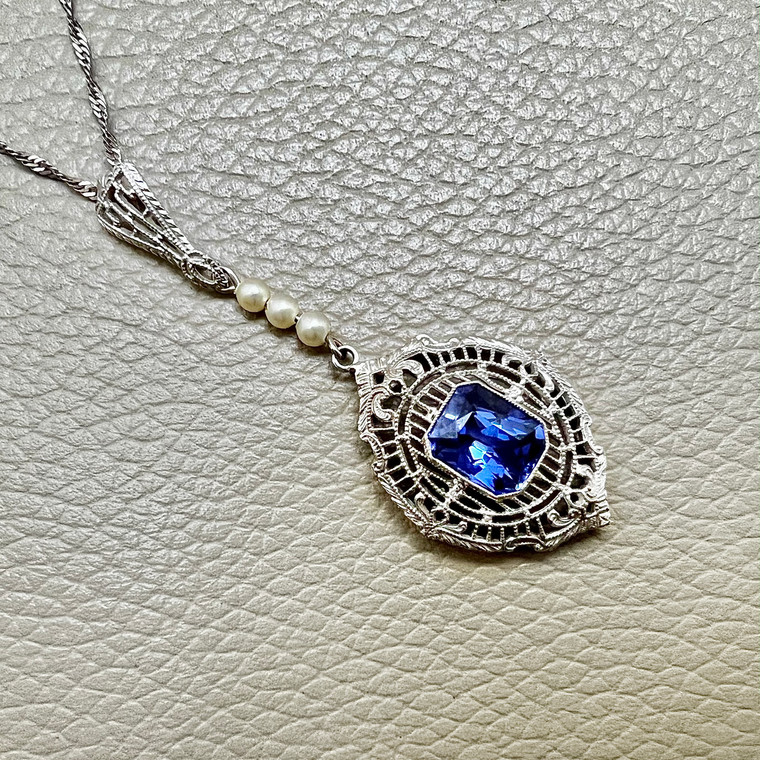 Vintage tanzanite and pearl pendant necklace 14kt white gold front view