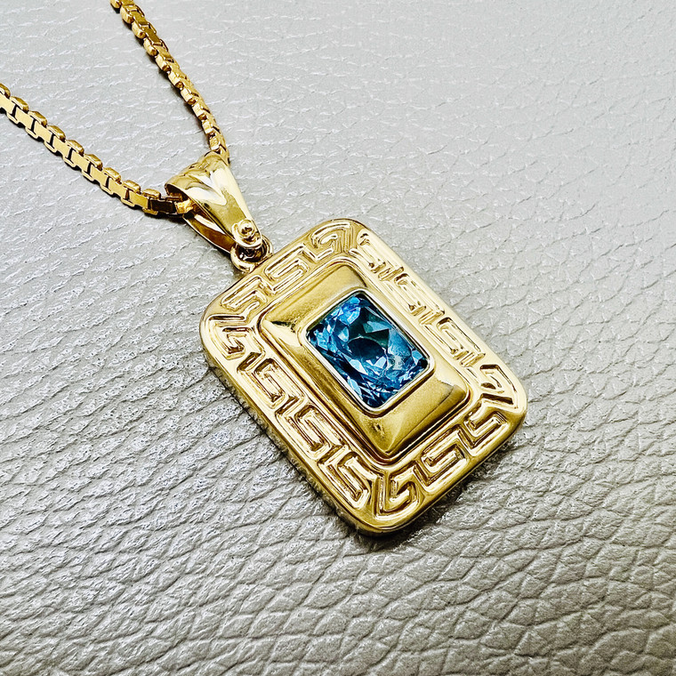 Stunning Greek Key Design Emerald Cut Blue Topaz Necklace in 14kt Yellow Gold.