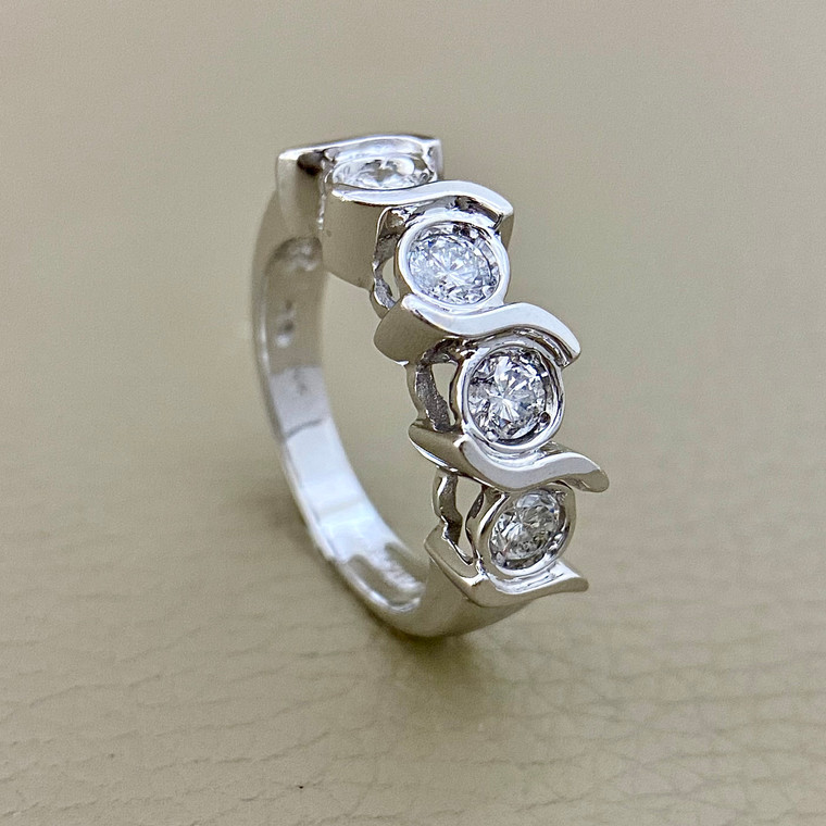 Exquisite 4-stone diamond Ring in 14kt white gold setting.