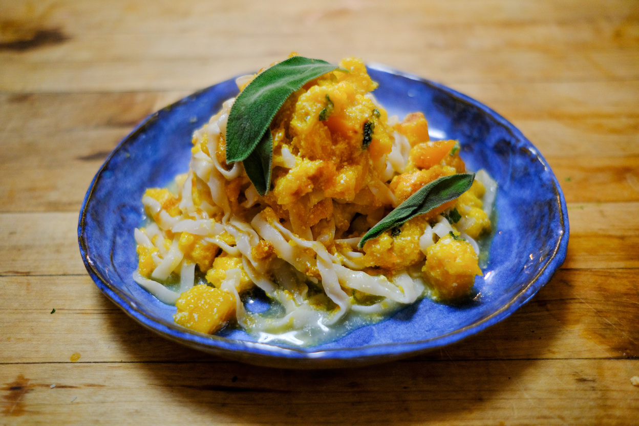 A bowl of It's Skinny fettuccine pasta with browned butter butternut squash and sage.