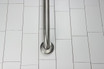 Frost 1001-SP24 Stainless Steel 24-inch Grab Bar with a 1.25-inch diameter, blending seamless functionality with elegance for bathroom safety and accessibility.